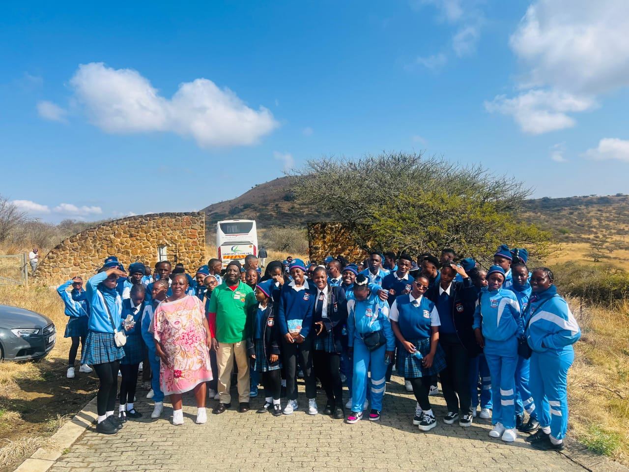School group at a battlefield site with guide